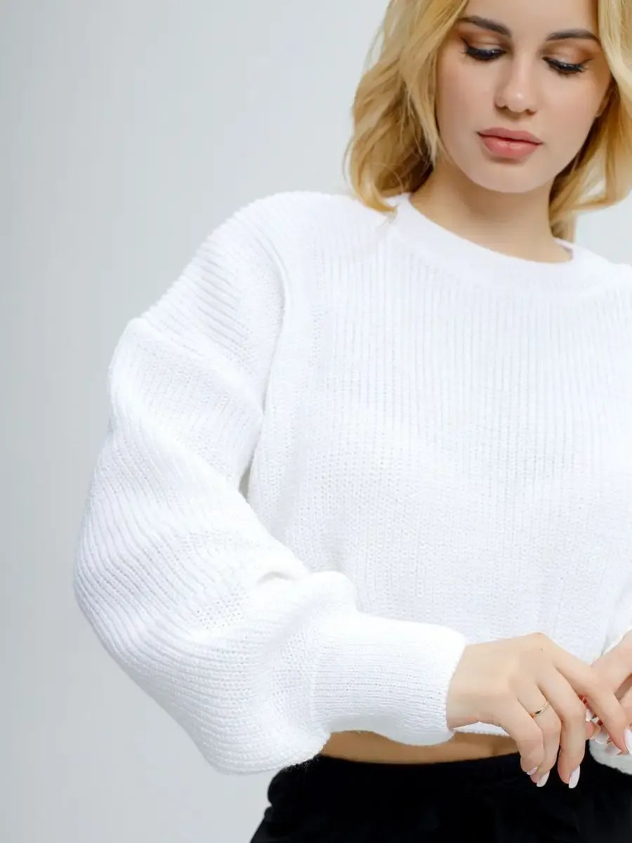 Model wearing Alba Pullover by Lauven, lightweight knit in soft white, showcasing oversized cropped design.