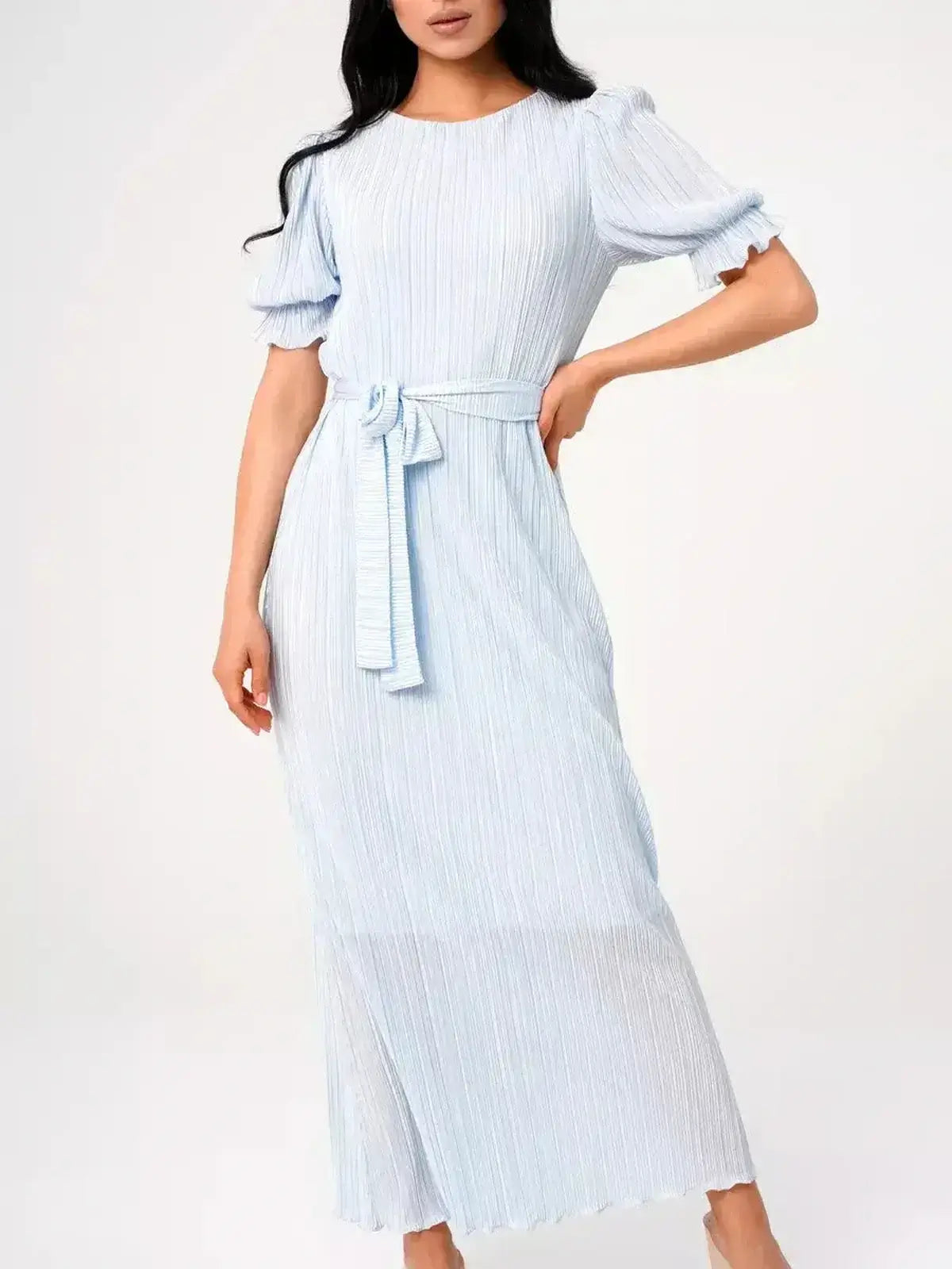 Angel Maxi Dress in light blue featuring delicate pleating and a self-tie waistbelt for elegant summer styling.