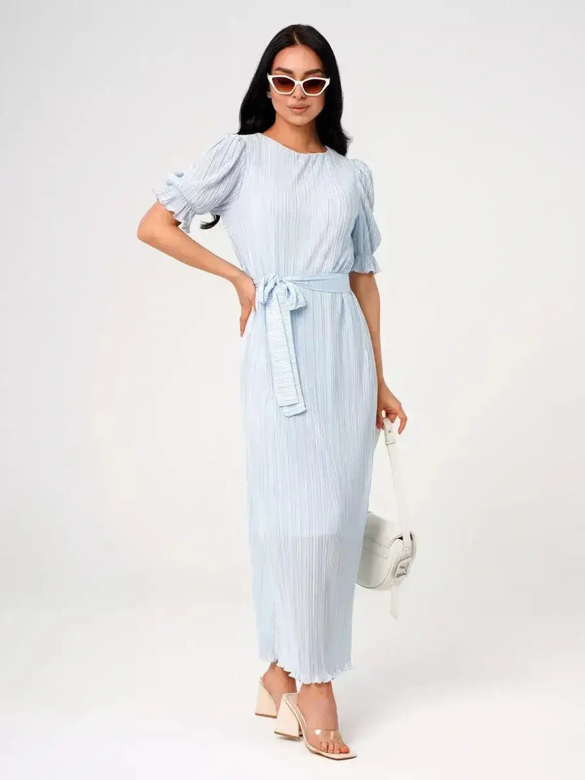 Angel Maxi Dress by Lauven – Light blue pleated dress with waist tie and puff sleeves, ideal for warm-weather occasions.