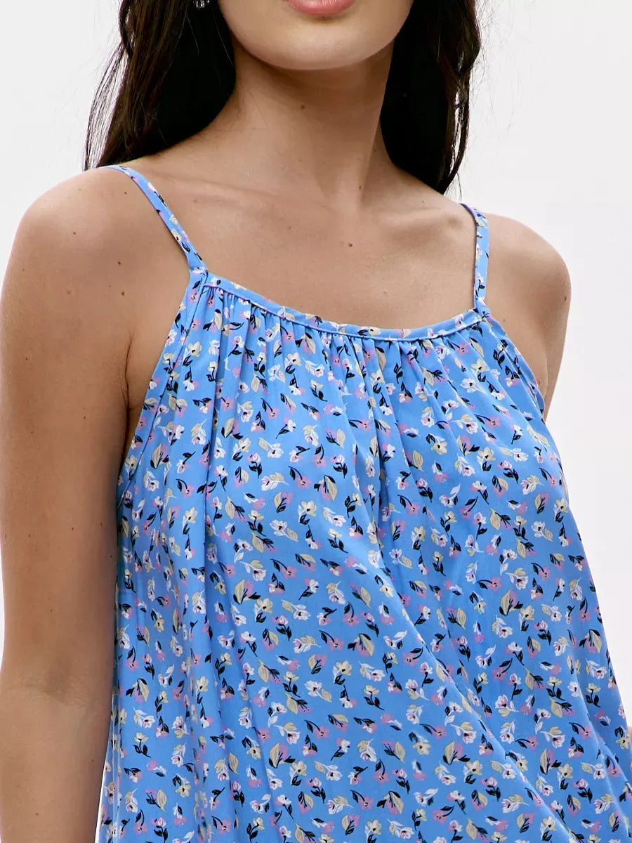 Azure Mini Dress by Lauven featuring a vibrant blue floral print and delicate spaghetti straps for summer style.