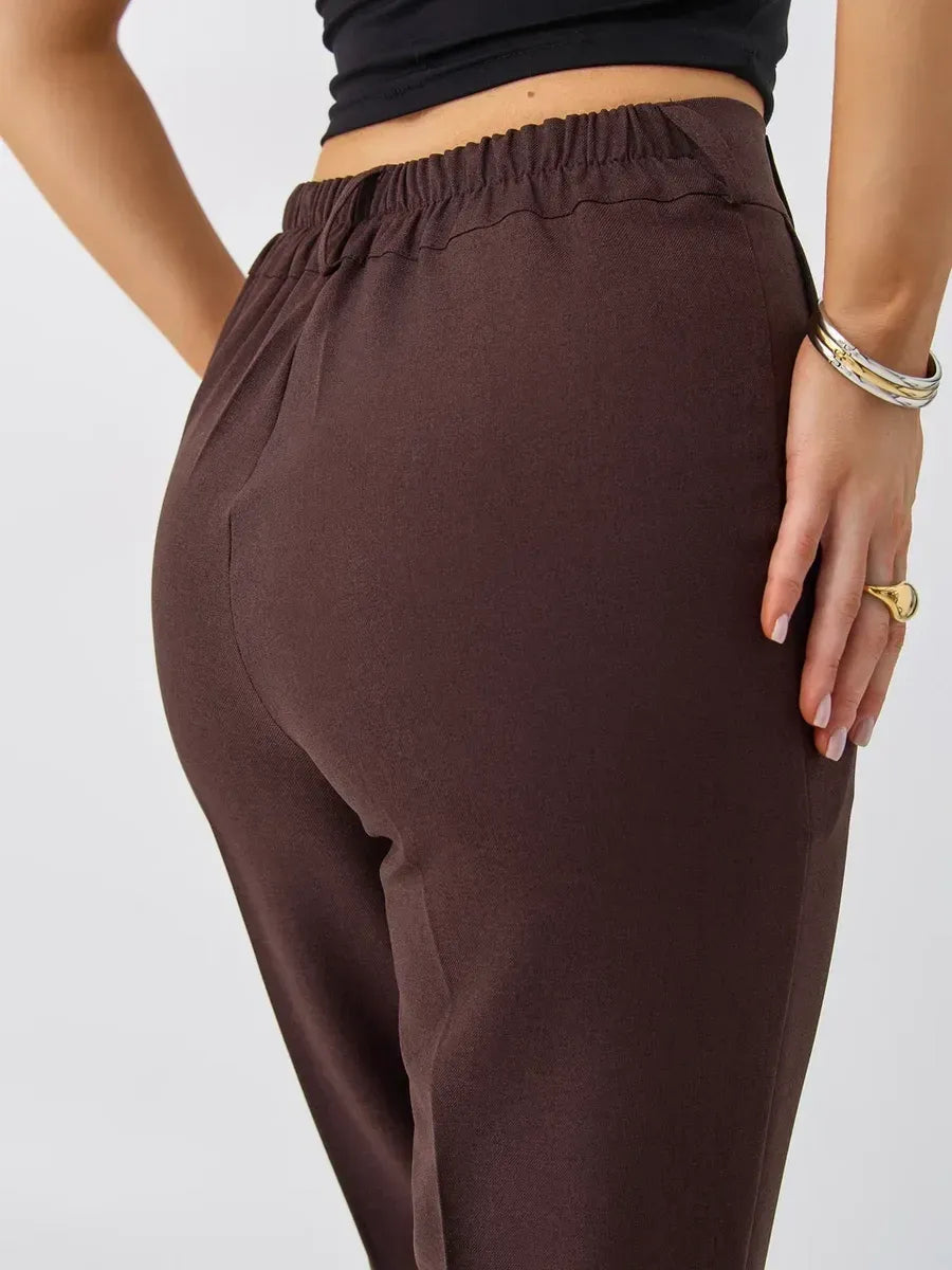 Close-up of high-waist chocolate pants from the Lauven Cacao Suit Set, showcasing a stylish rear view.