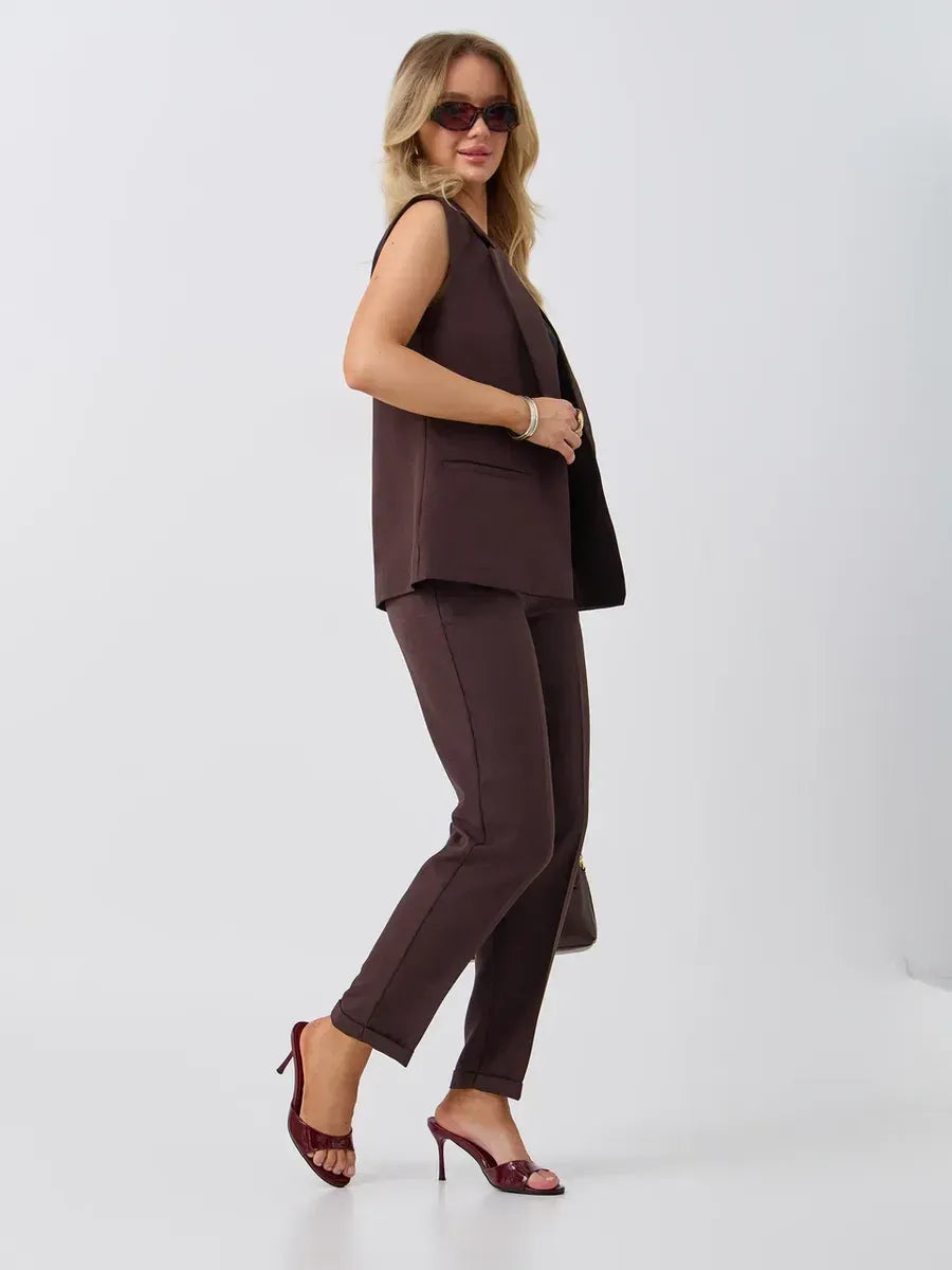 Cacao Suit Set by Lauven featuring a sleeveless chocolate vest and high-waist pants, styled for a chic look.