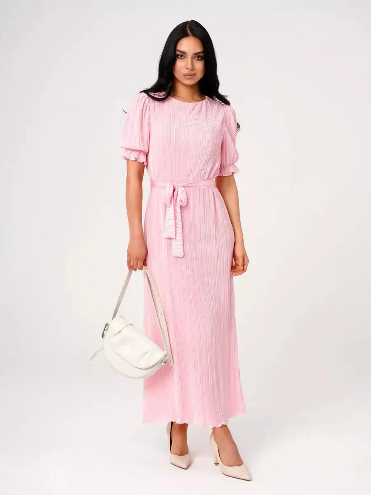 Candy Maxi Dress by Lauven in pink pleated fabric with puff sleeves and tie waist, showcasing elegance and femininity.