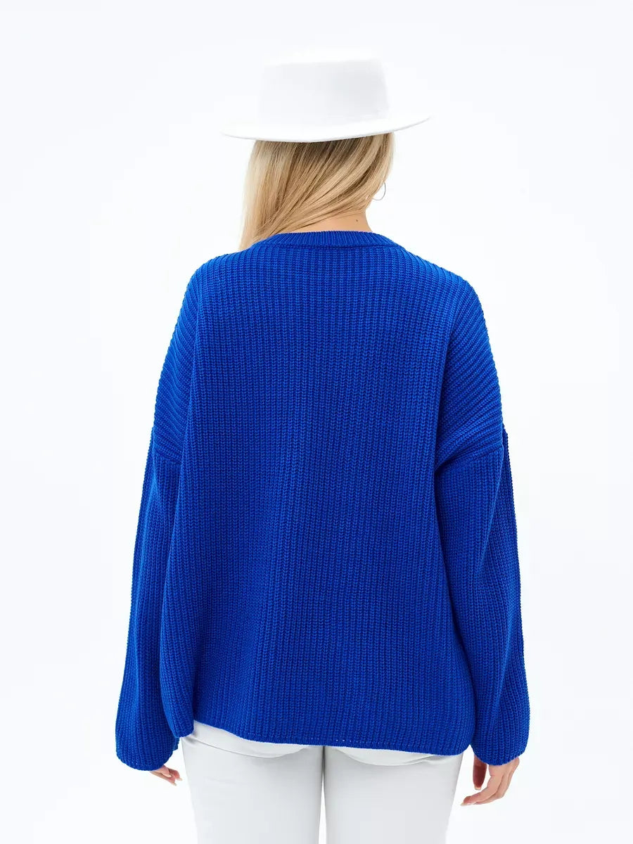 Back view of Capri Sweater in vibrant electric blue, oversized knit by Lauven, showcasing its relaxed silhouette.
