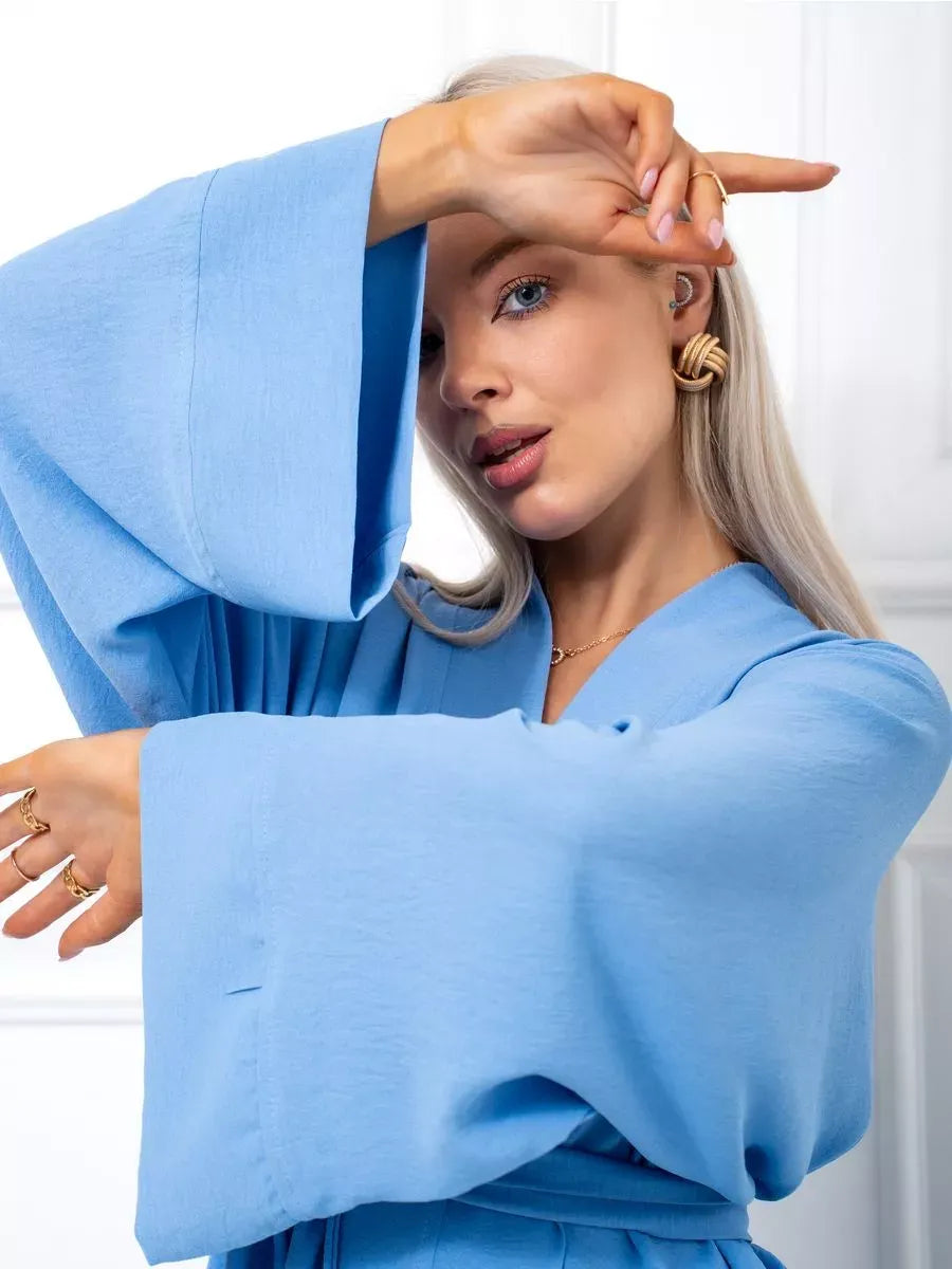 Celeste Suit Set showcased by model in light blue kimono-style robe by Lauven, highlighting elegant oversized design.