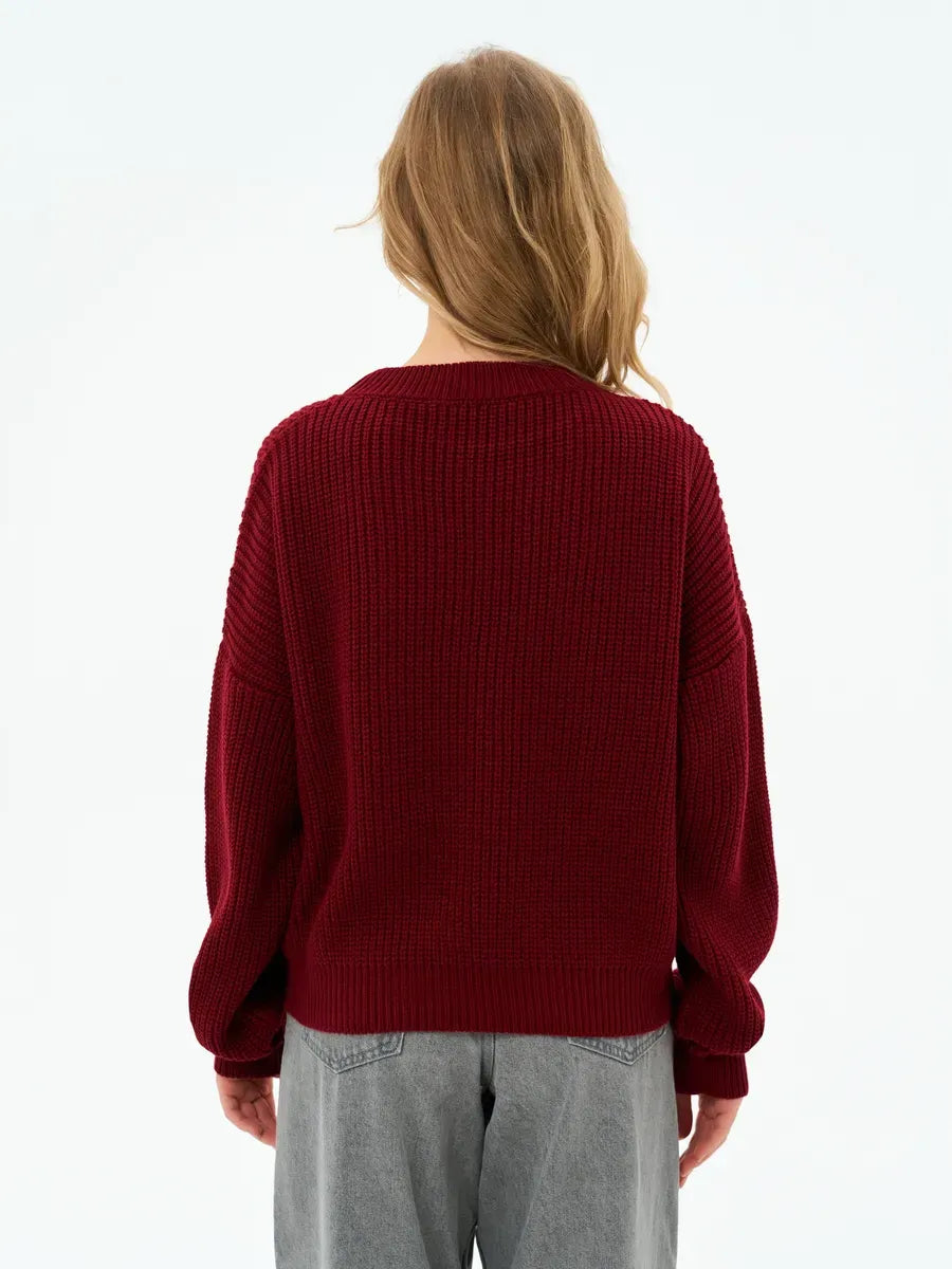 Back view of the Crimson Charm Sweater by Lauven in deep burgundy, showcasing its oversized knit and relaxed silhouette.