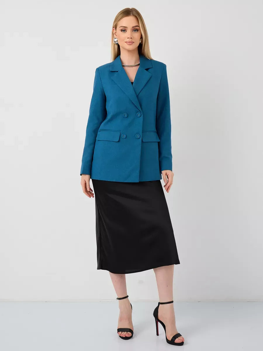 Diana Blazer by Lauven, classic cropped elegance in teal worn with a sleek black skirt and heels.