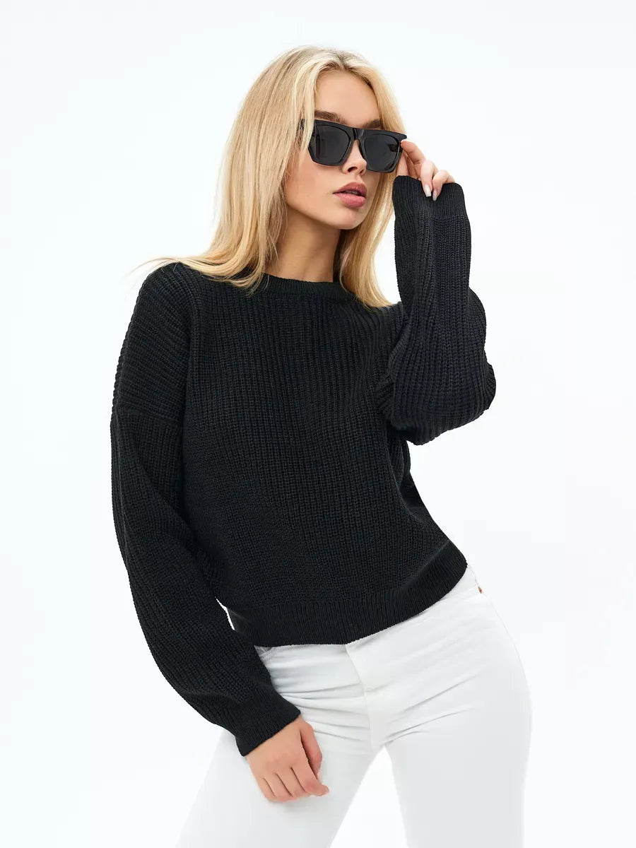 Model wearing Eclipse Sweater by Lauven, an oversized black knit for modern elegance and comfort.