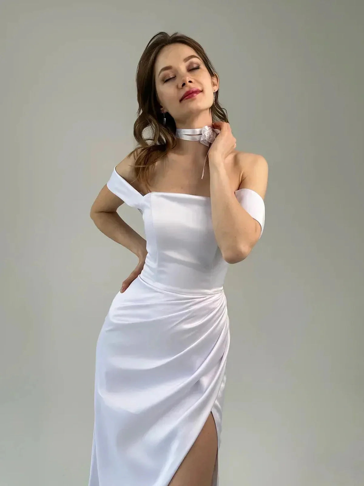 Eira Occasion Dress by Lauven - White satin off-shoulder gown with draping and slit for elegant events.