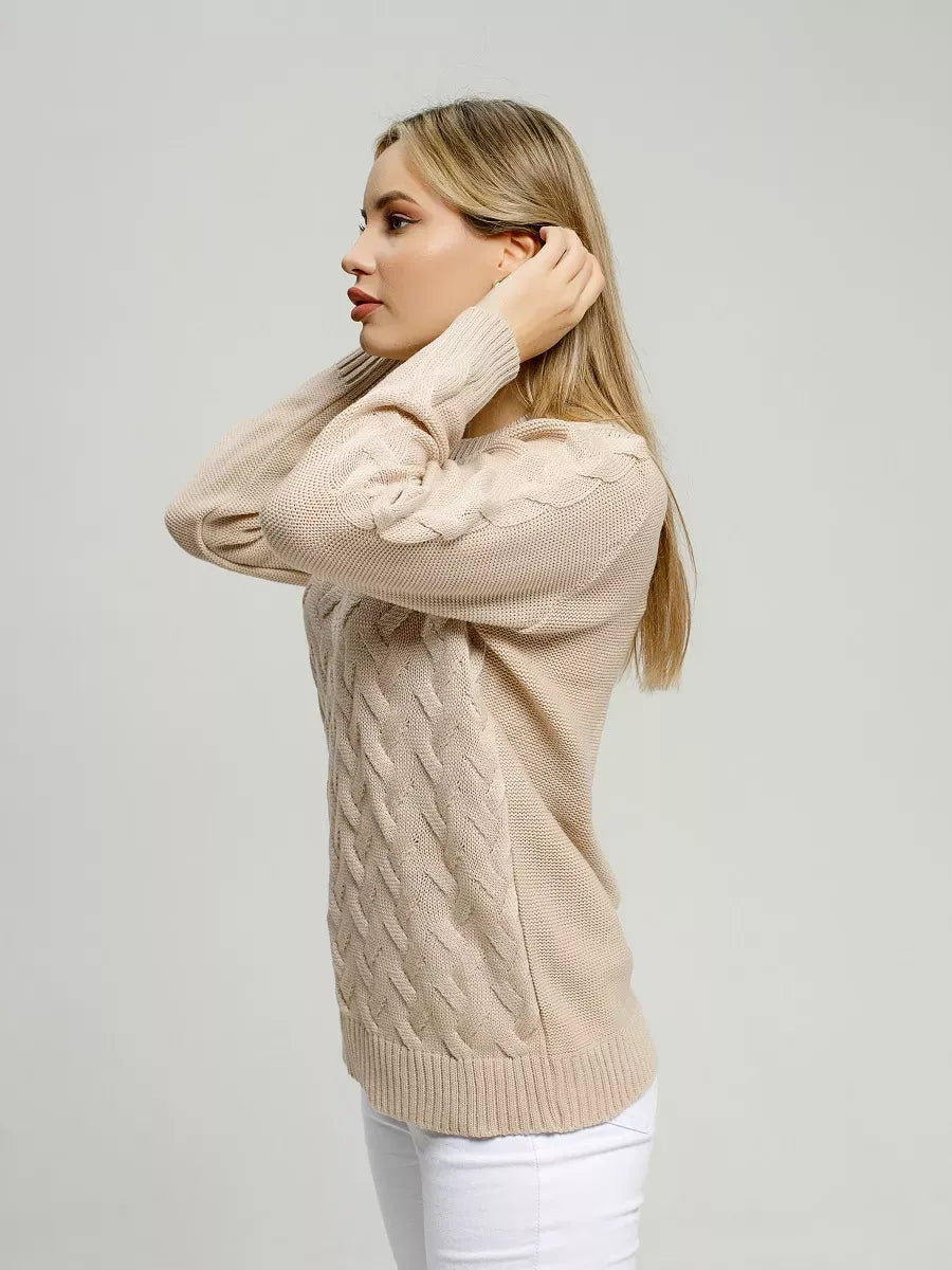 Side view of a woman wearing the Elara Sweater by Lauven, featuring soft light beige knitwear for breathable comfort.
