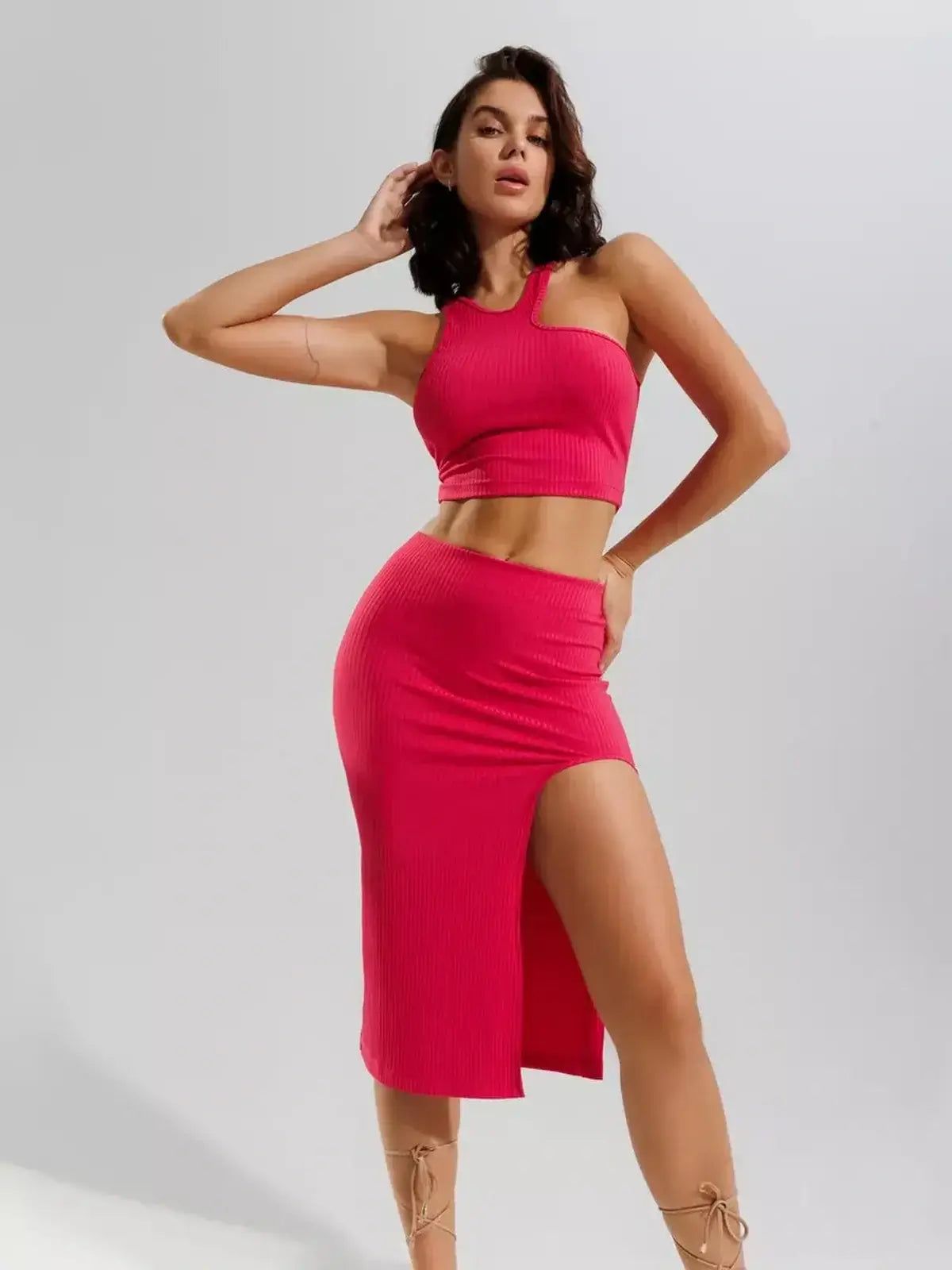 Fuchsia Flair Set by Lauven featuring a ribbed knit crop top and high-waisted midi skirt with thigh slit.
