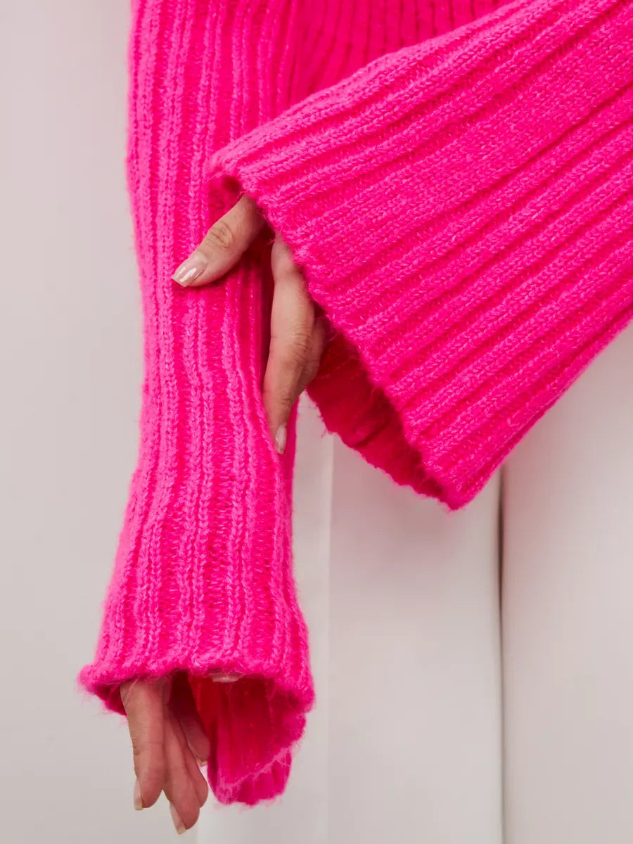 Selene Sweater by Lauven featuring a vibrant fuchsia cropped knit with wide cuffs.