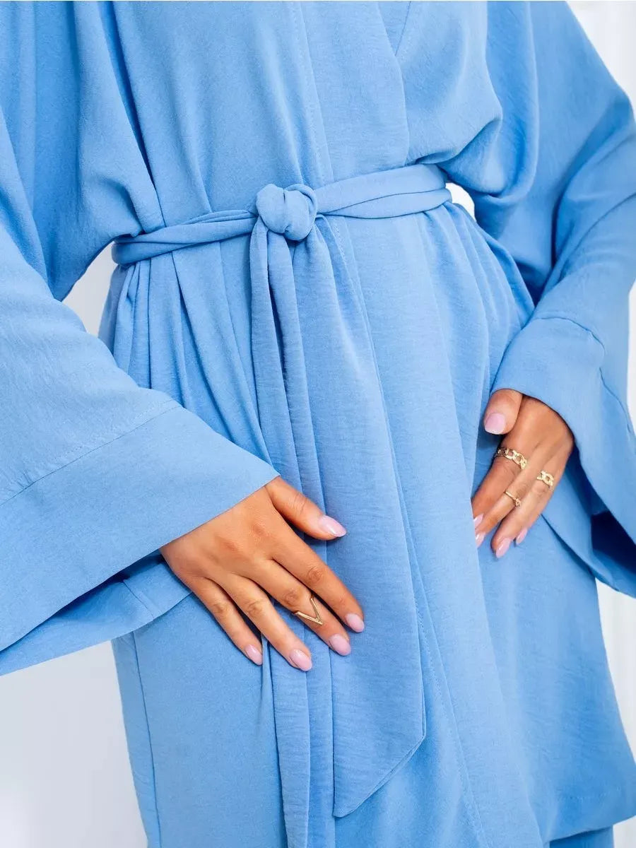 Celeste Suit Set - Elegant soft blue oversized robe from Lauven, showcasing stylish wide sleeves and a belted waist.