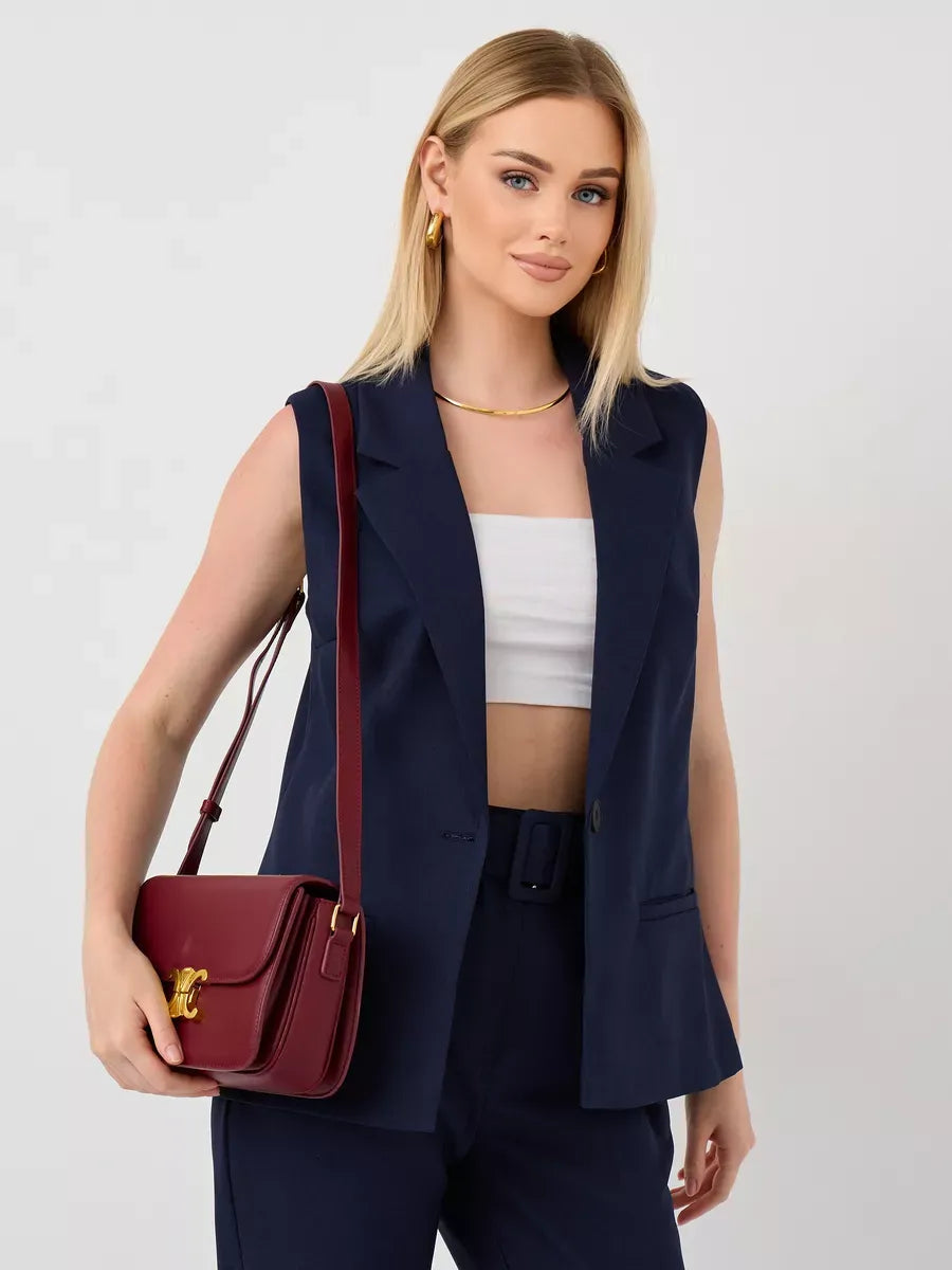 Orion Suit Set by Lauven featuring a sleeveless navy vest and high-waist pants, stylish look for women.