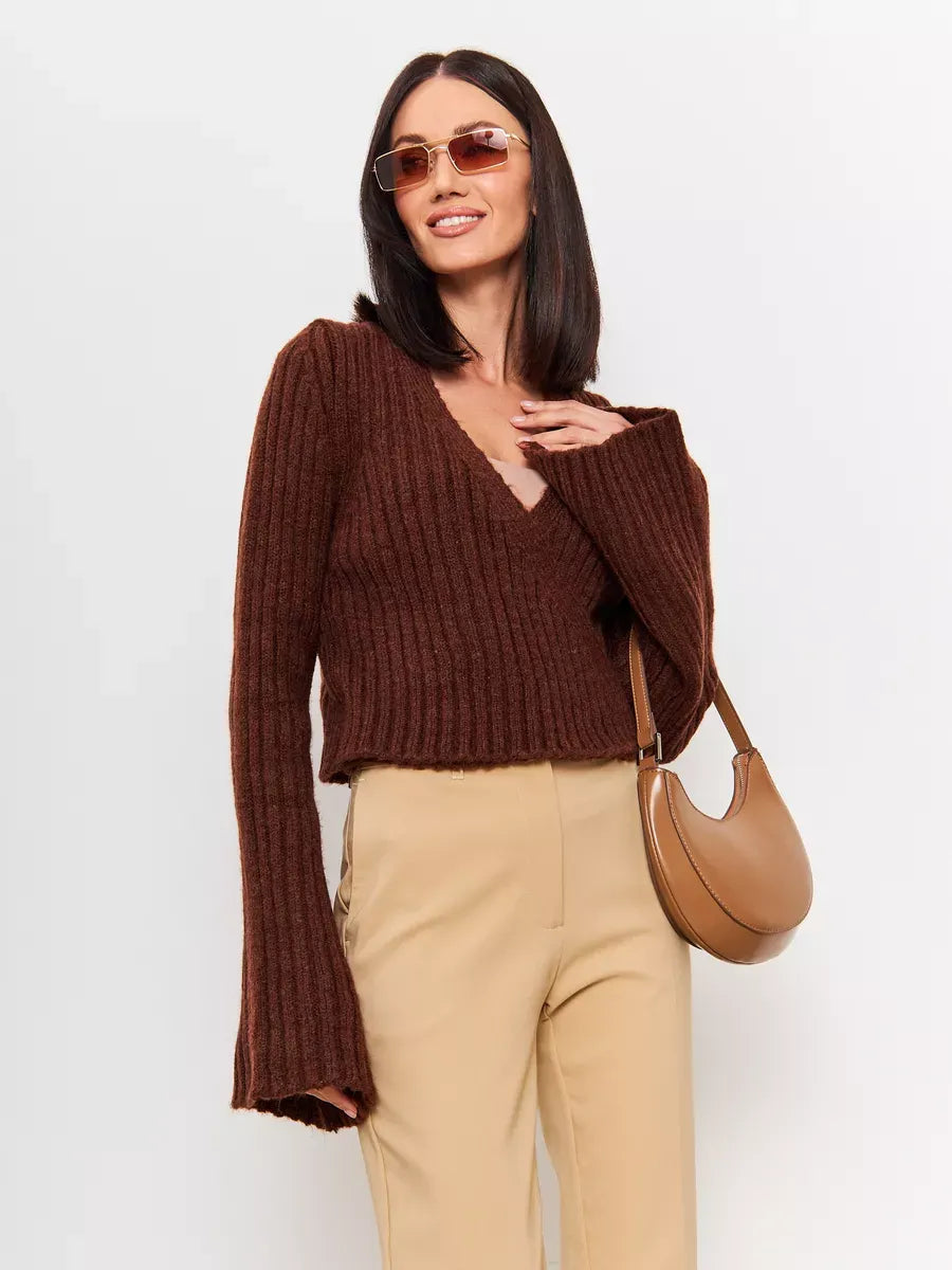 Lauven Orion Sweater - Cropped brown knit with V-neck and wide sleeves, paired with stylish sunglasses and bag.