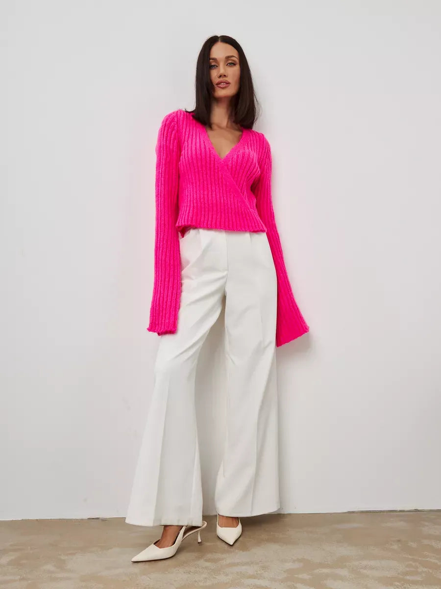 Selene Sweater by Lauven - Cropped V-Neck Knit in striking fuchsia with wide cuffs and stylish white pants.