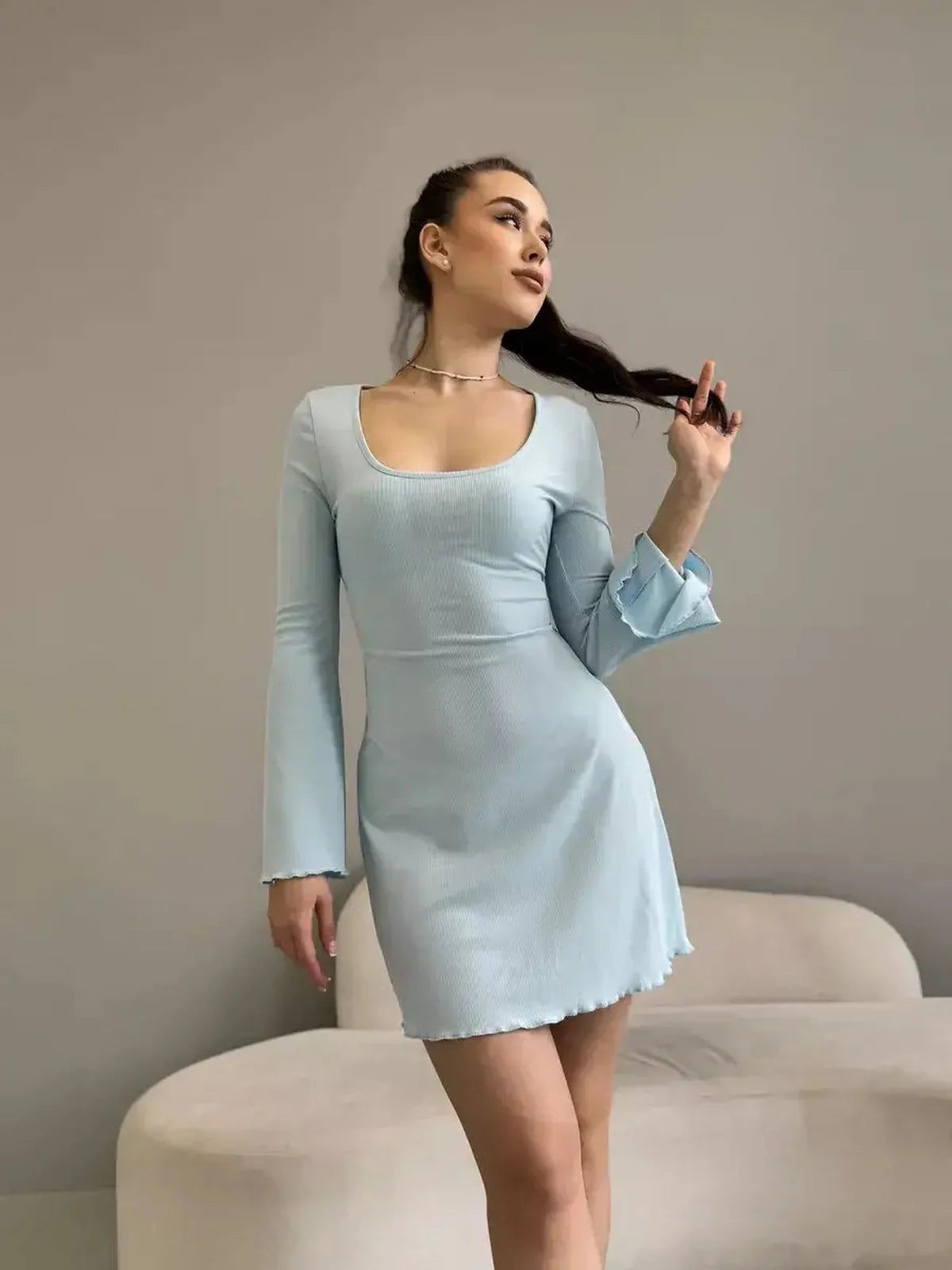 Isabella Mini Dress by Lauven in pastel blue ribbed knit with long sleeves and flared hem, perfect for modern women.