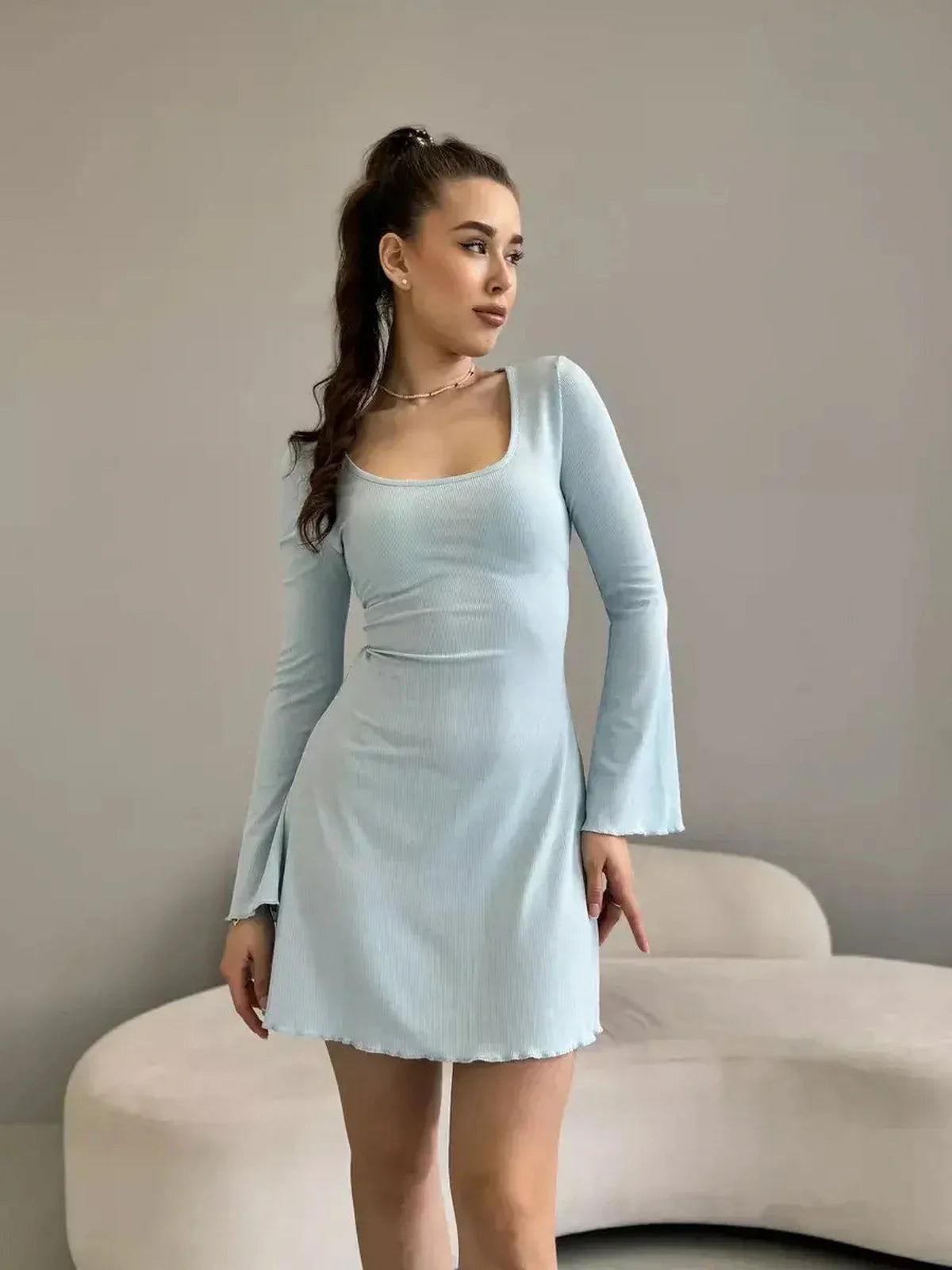 Isabella Mini Dress in pastel blue ribbed knit with long sleeves and flared hem by Lauven.