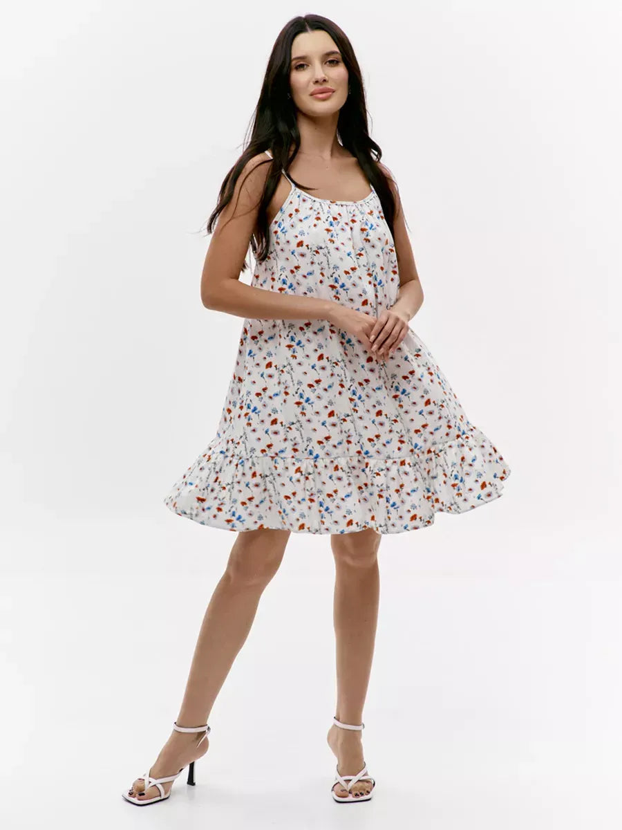 Lauven Ivory Mini Dress featuring a floral print and open back design, perfect for summer outings.