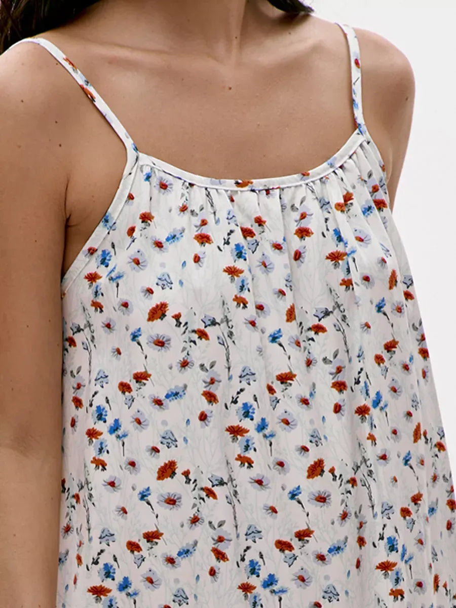 Ivory Mini Dress by Lauven featuring a delicate floral print and adjustable straps for a stylish summer look.