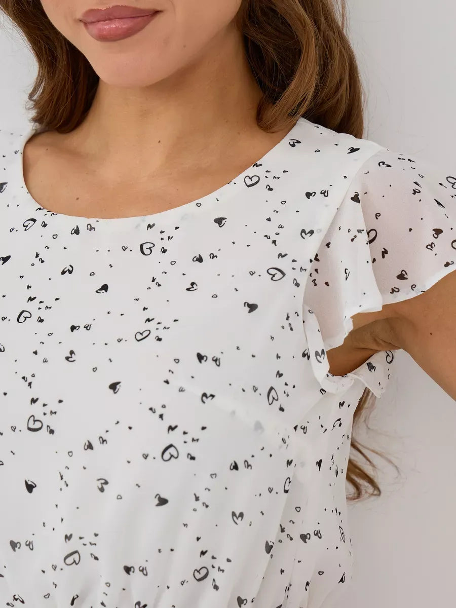 Ivory Mini Dress by Lauven featuring delicate ruffle sleeves and heart print design for special occasions.