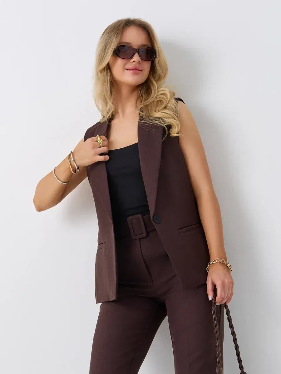 Chic model wearing Cacao Suit Set by Lauven, featuring a sleeveless chocolate vest and high-waist pants.