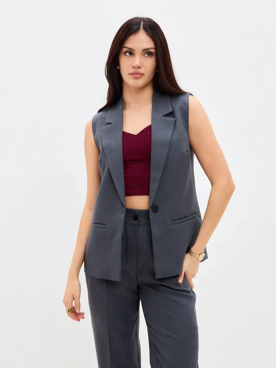 Graphite Suit Set by Lauven featuring a sleeveless graphite vest and high-waist pants, perfect for modern women's style.