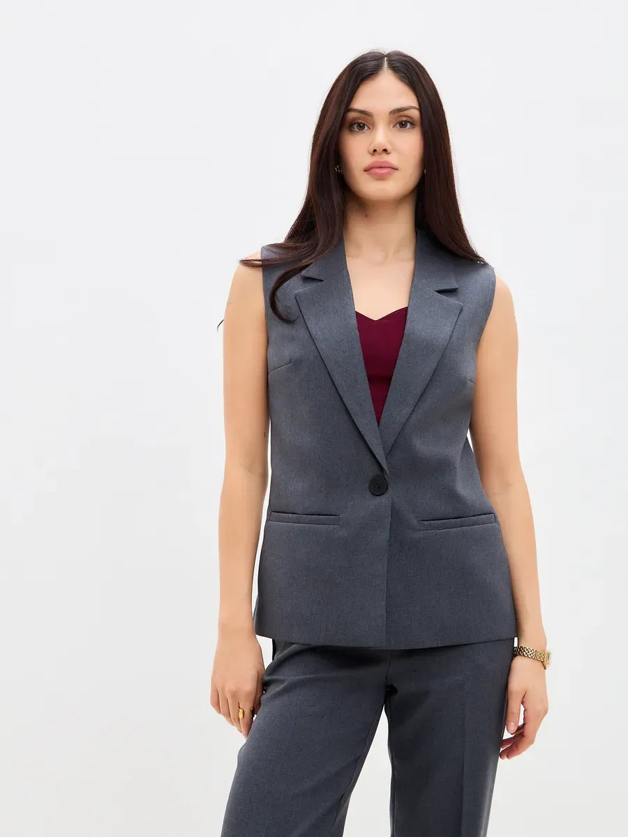 Graphite Suit Set by Lauven featuring a sleeveless vest and tailored high-waist pants for a modern, stylish look.
