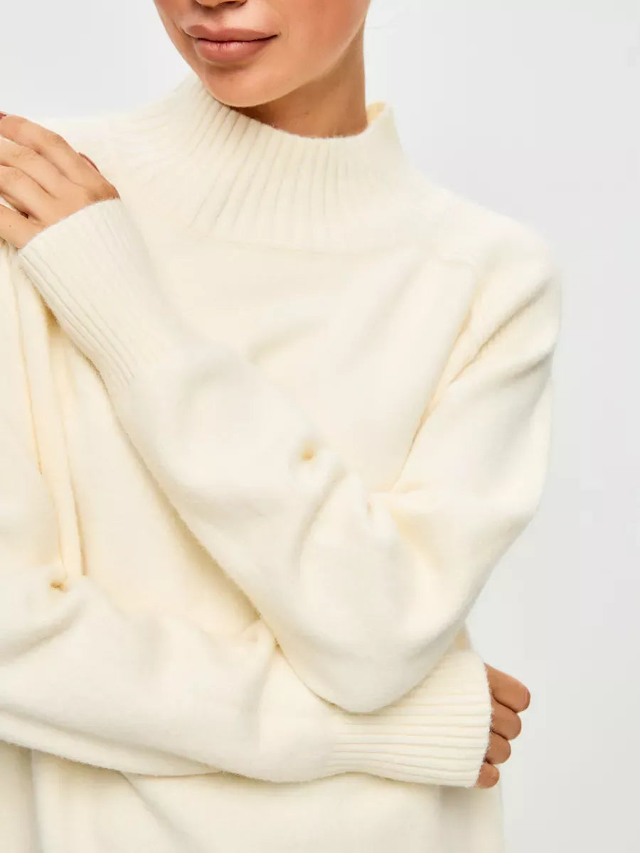 Luna Sweater by Lauven, oversized cashmere blend in ivory with a high neck showcasing elegance and comfort.