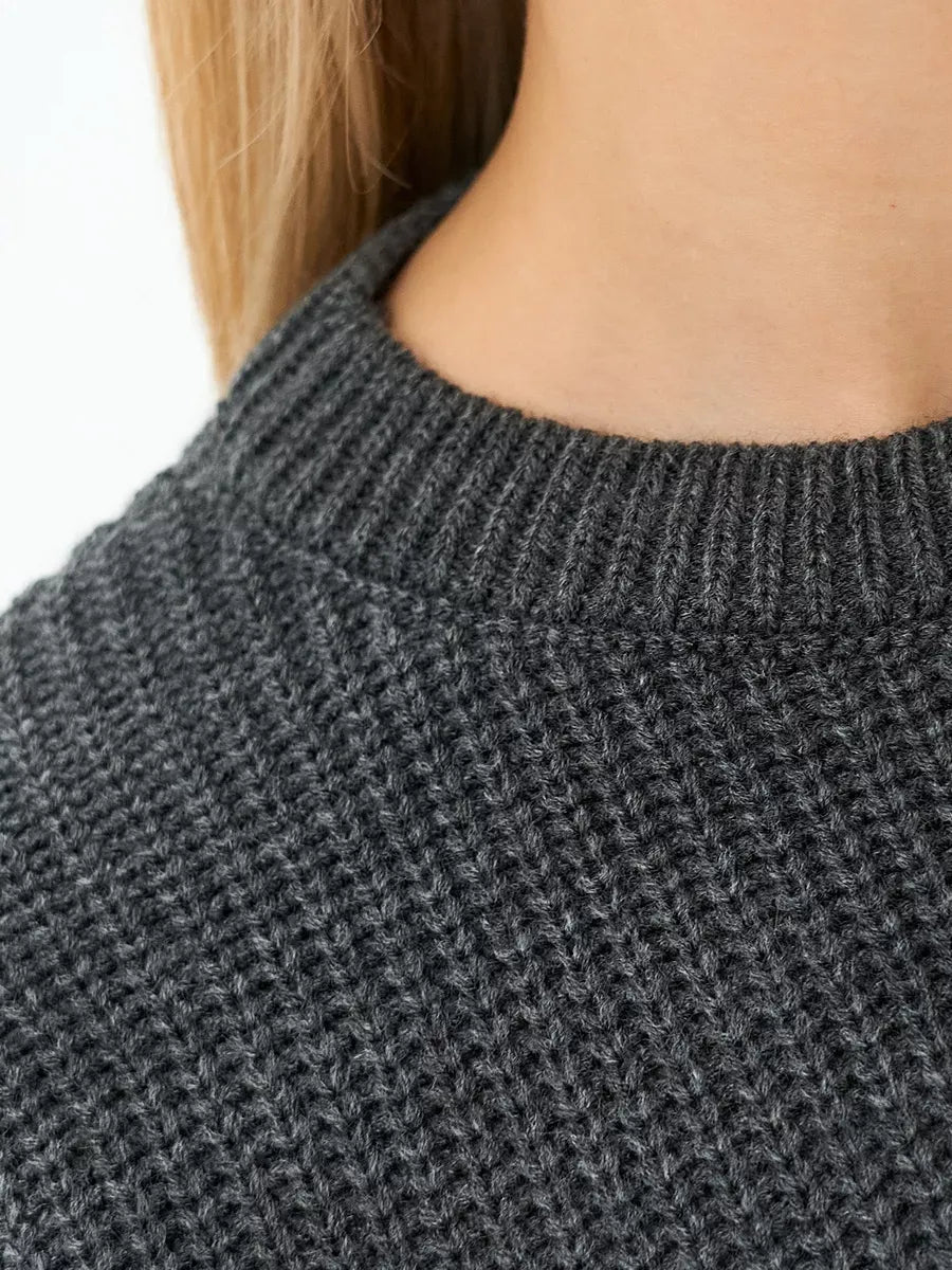 Luna Sweater by Lauven, close-up of the textured knit in charcoal gray, showcasing its oversized silhouette.