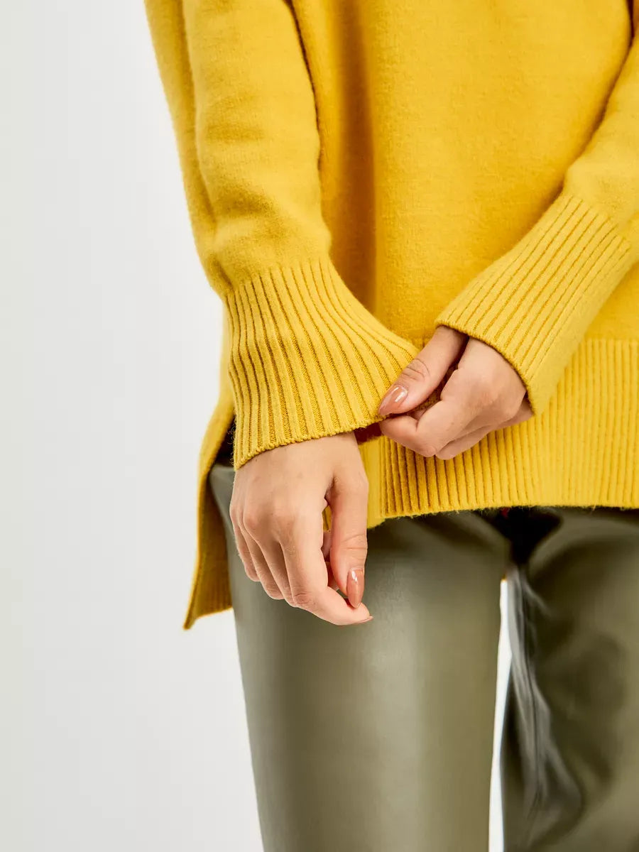 Marigold Sweater by Lauven featuring oversized fit, high neck, and ribbed finish for a stylish cold-weather look.