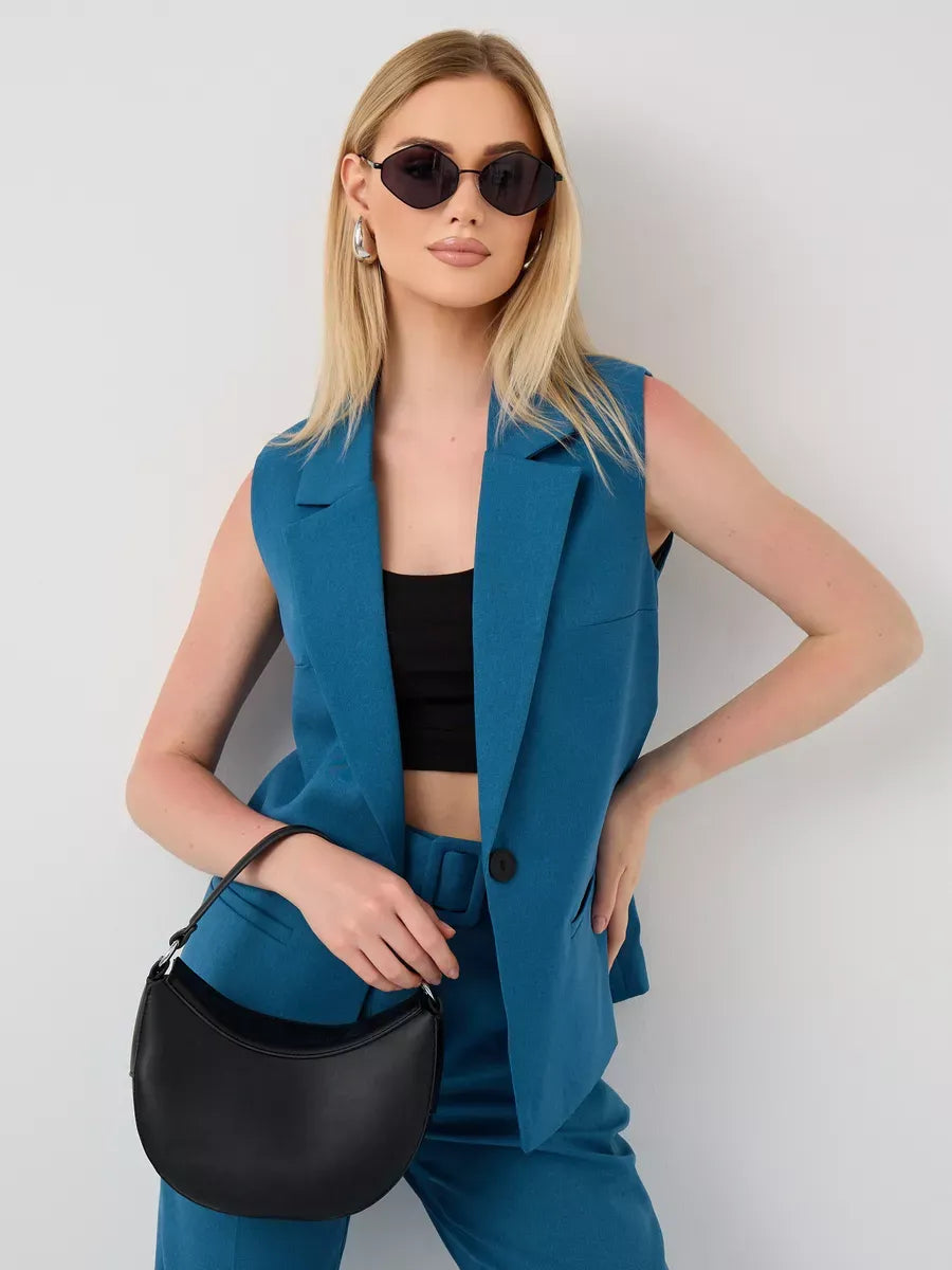 Lauven Marine Suit Set featuring a sleeveless teal vest and high-waist pants, styled with a black handbag and sunglasses.