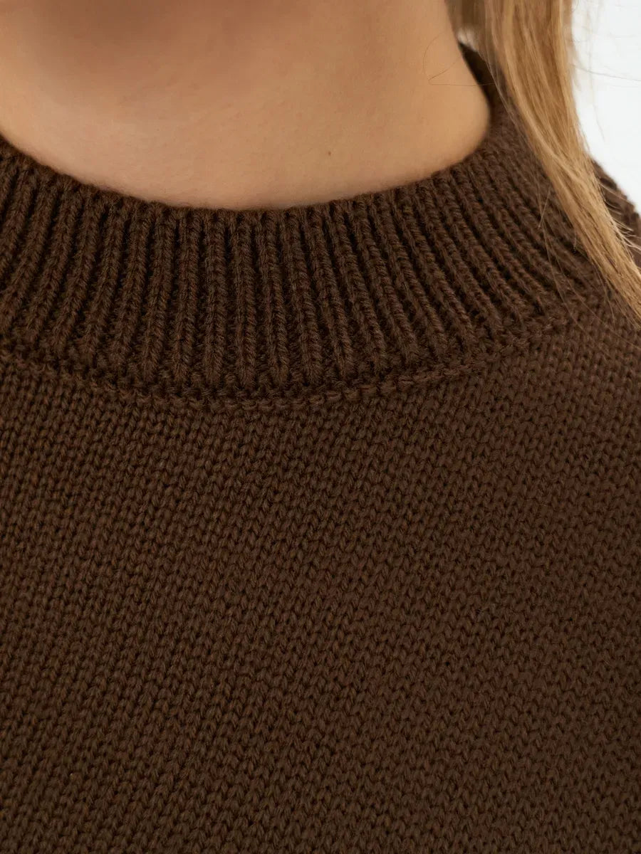 Close-up of Mocha Sweater by Lauven, featuring a ribbed neckline and soft brown knit fabric.