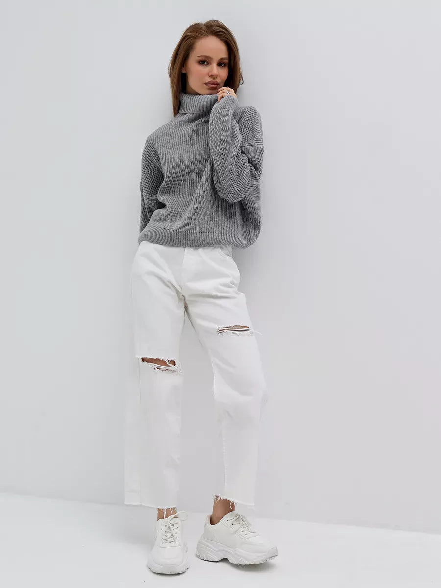 Nimbus Pullover by Lauven - Oversized light gray knit sweater with high neck worn with white ripped jeans.