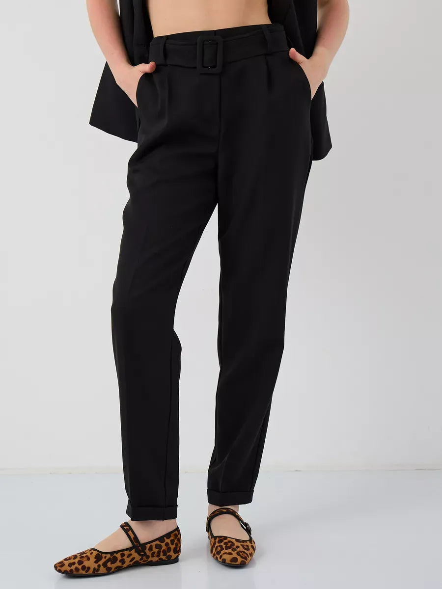 Noir Suit Set from Lauven featuring tailored high-waist black trousers and stylish animal print flats.
