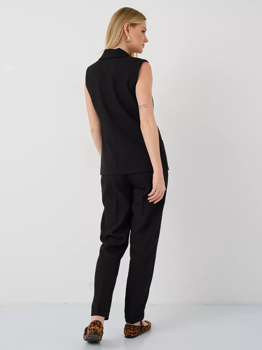 Noir Suit Set by Lauven featuring a sleeveless vest and high-waist pants, showcasing a modern and elegant design.