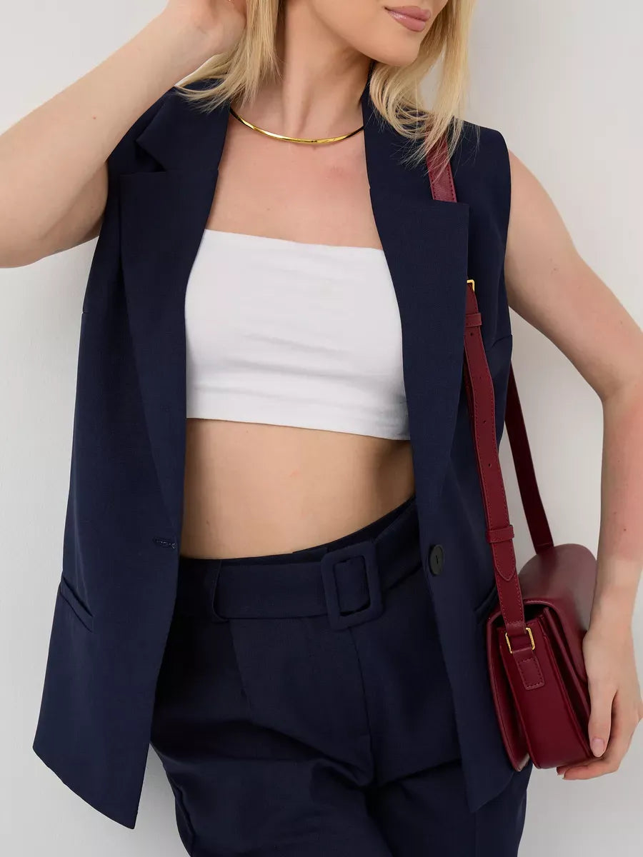 Orion Suit Set by Lauven featuring sleeveless navy vest and high-waist pants for a chic look.
