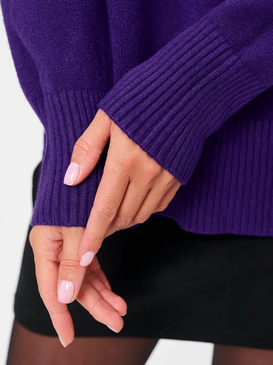 Lauven Violet Sweater detail showcasing ribbed cuffs and deep purple hue, perfect for fall and winter styling.