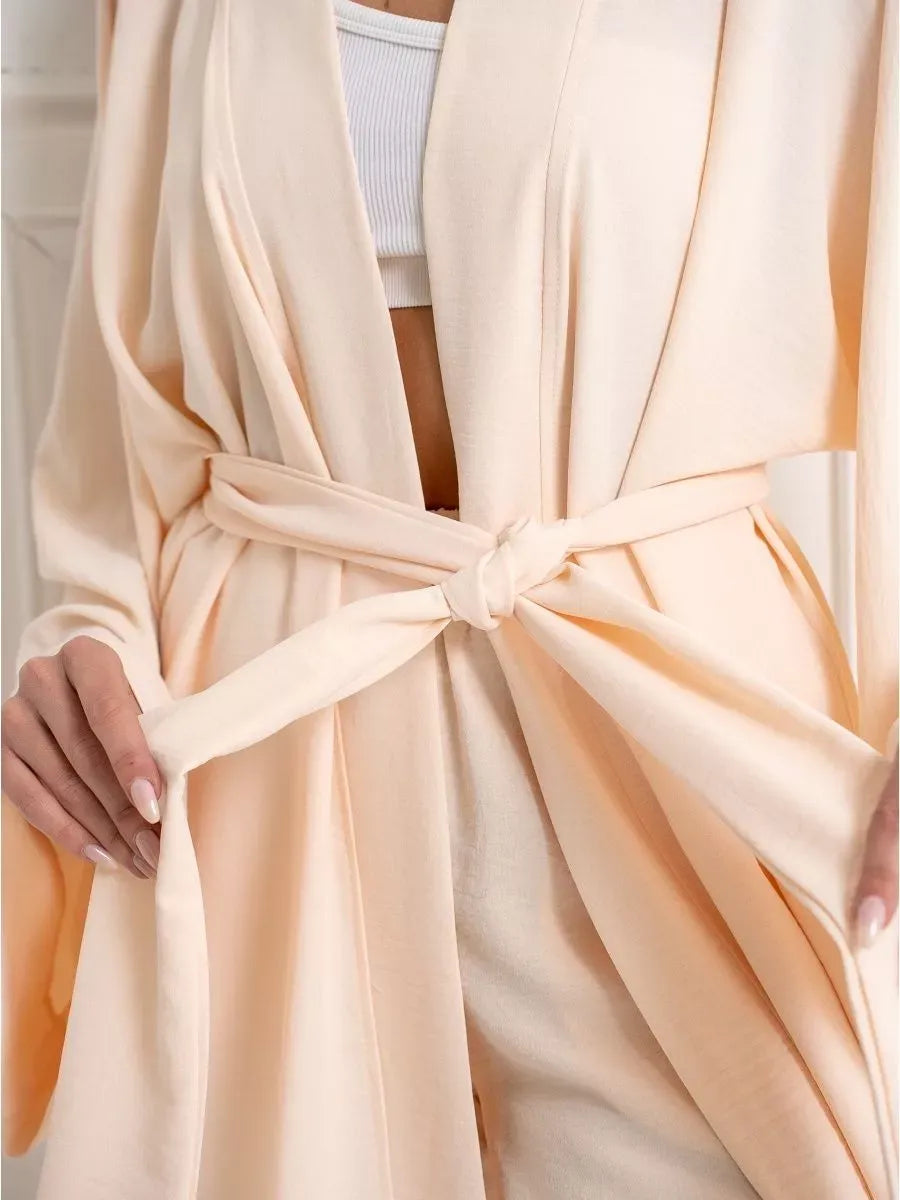 Sahara Suit Set by Lauven features an oversized beige wrap with a tie belt, offering a soft and elegant look.