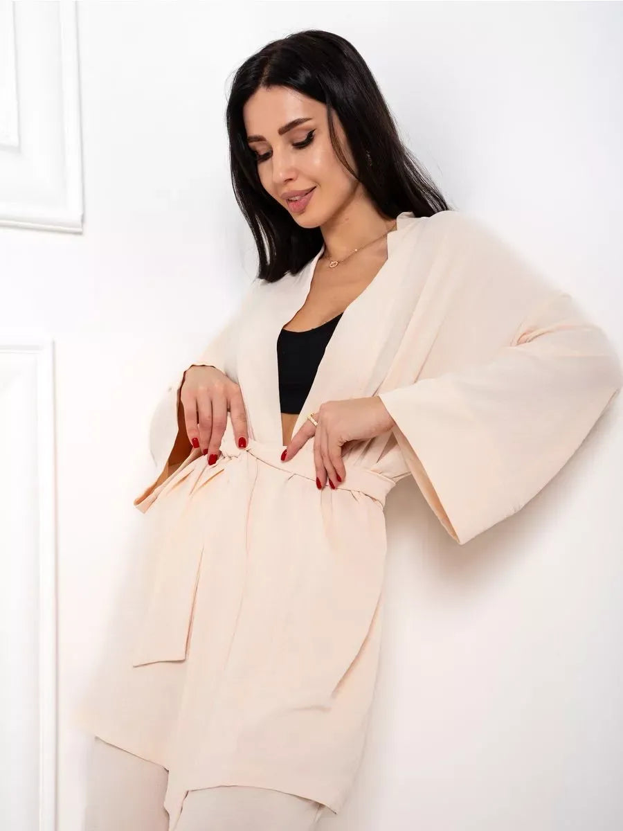 Model showcasing the Sahara Suit Set from Lauven, featuring a luxurious beige oversized jacket with a flattering silhouette.