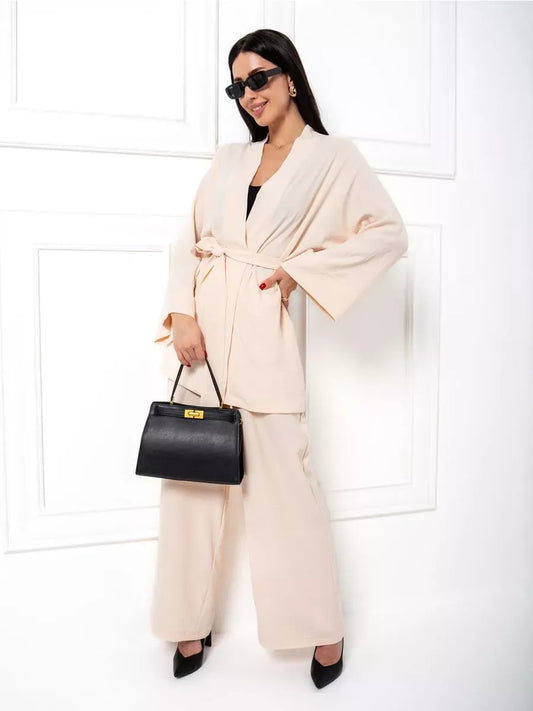 Sahara Suit Set by Lauven, showcasing a luxurious beige oversized two-piece set with wide-leg trousers and a stylish belt.