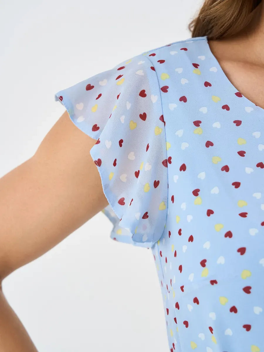 Sky Mini Dress by Lauven – Light blue dress with ruffle sleeve and heart print details for elegant autumn occasions.