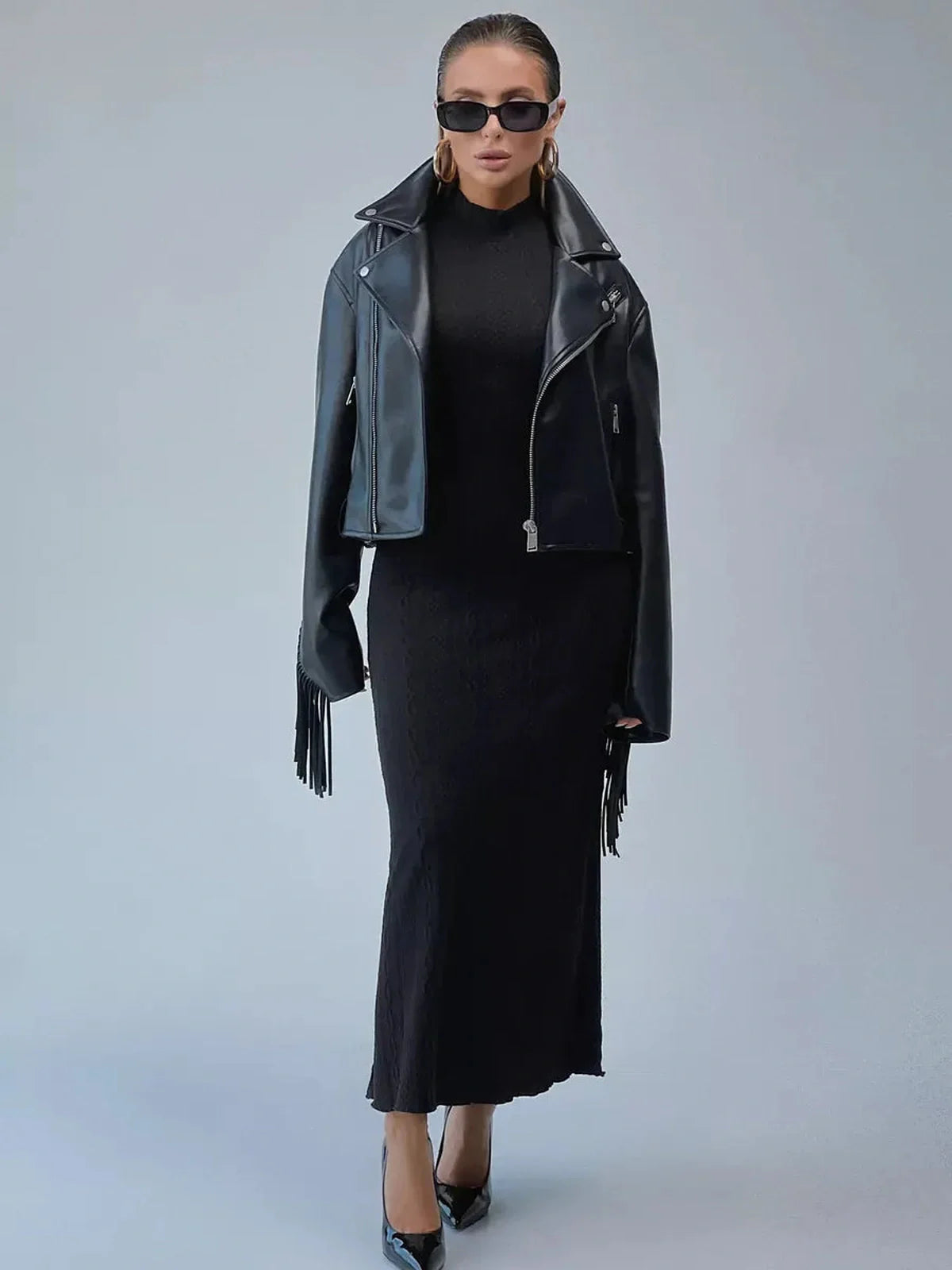 Leah Maxi Dress by Lauven worn with a leather jacket and sunglasses, showcasing a sleek black bodycon silhouette.