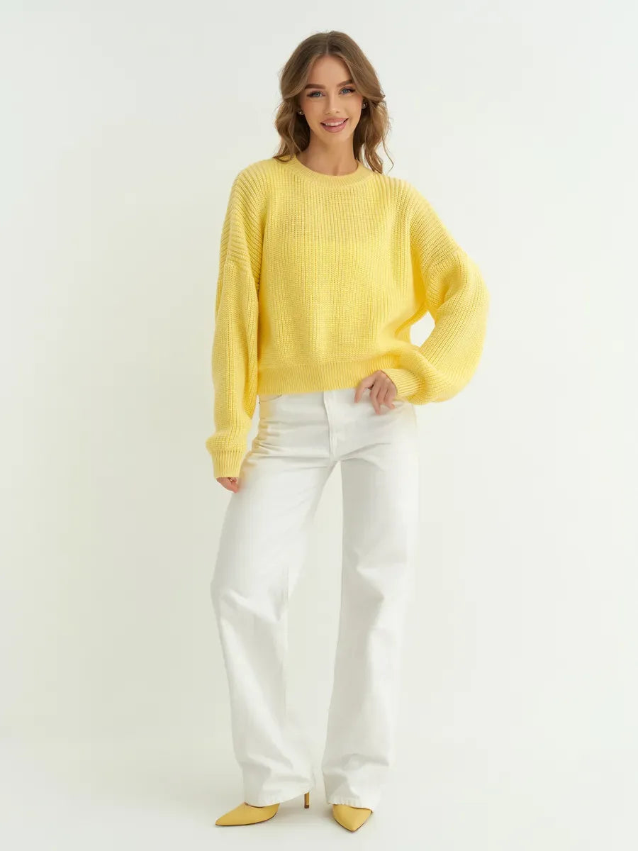 Lemonade Sweater by Lauven: Oversized knit sweater in vibrant yellow, styled with white jeans for a fresh look.