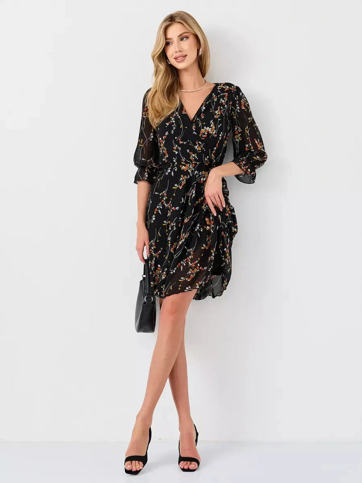 Lotus Mini Dress by Lauven featuring a black floral wrap design, deep V-neckline, and 3/4 puff sleeves.