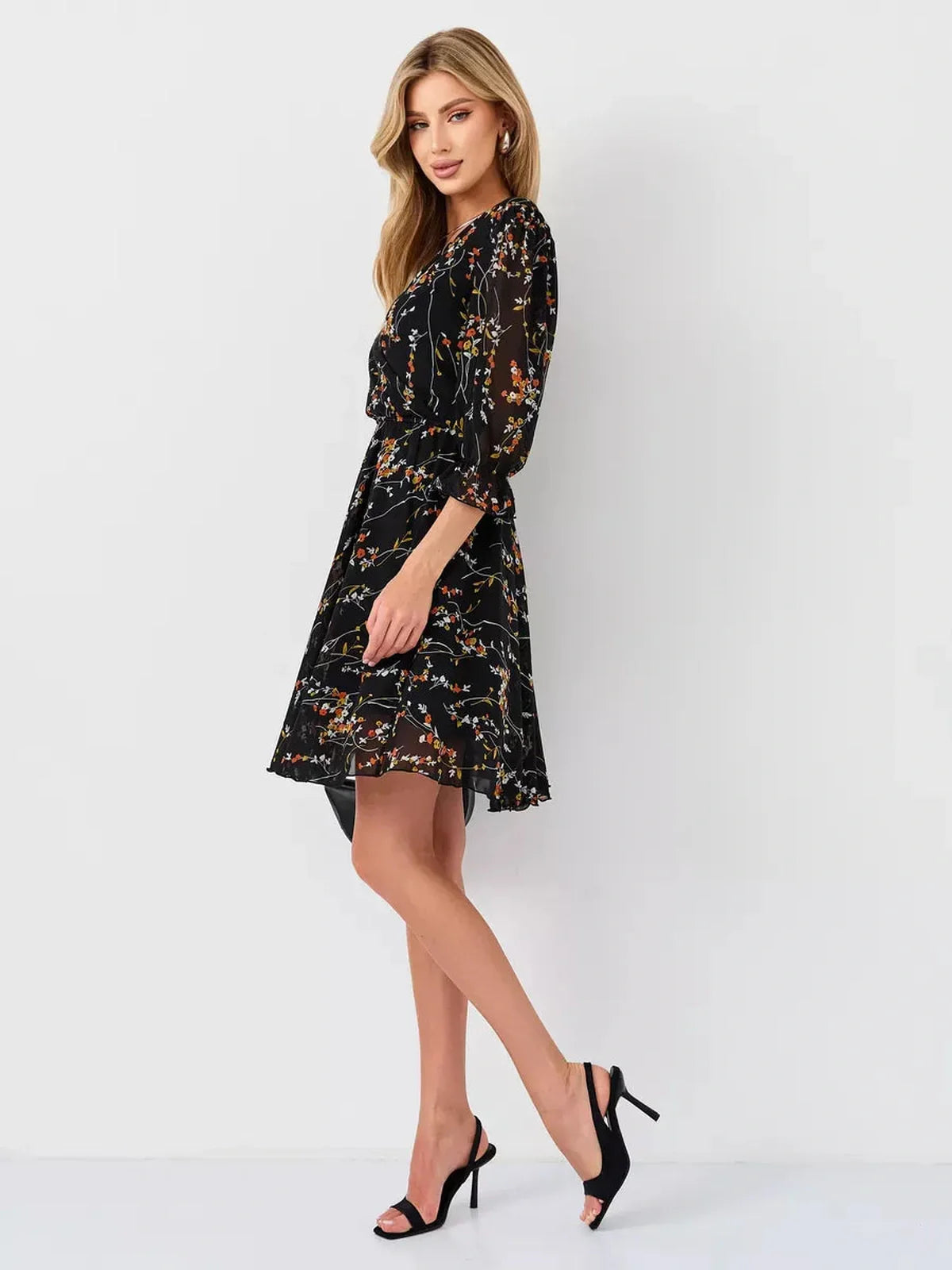 Lotus Mini Dress by Lauven, black floral wrap dress with deep V-neckline and 3/4 sleeves.