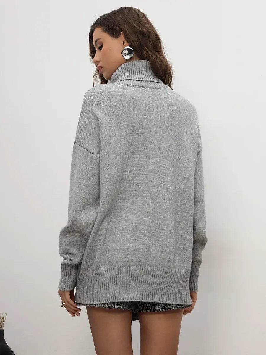 Back view of the Lyra Sweater in light grey by Lauven, showcasing refined minimalism and cozy sophistication.