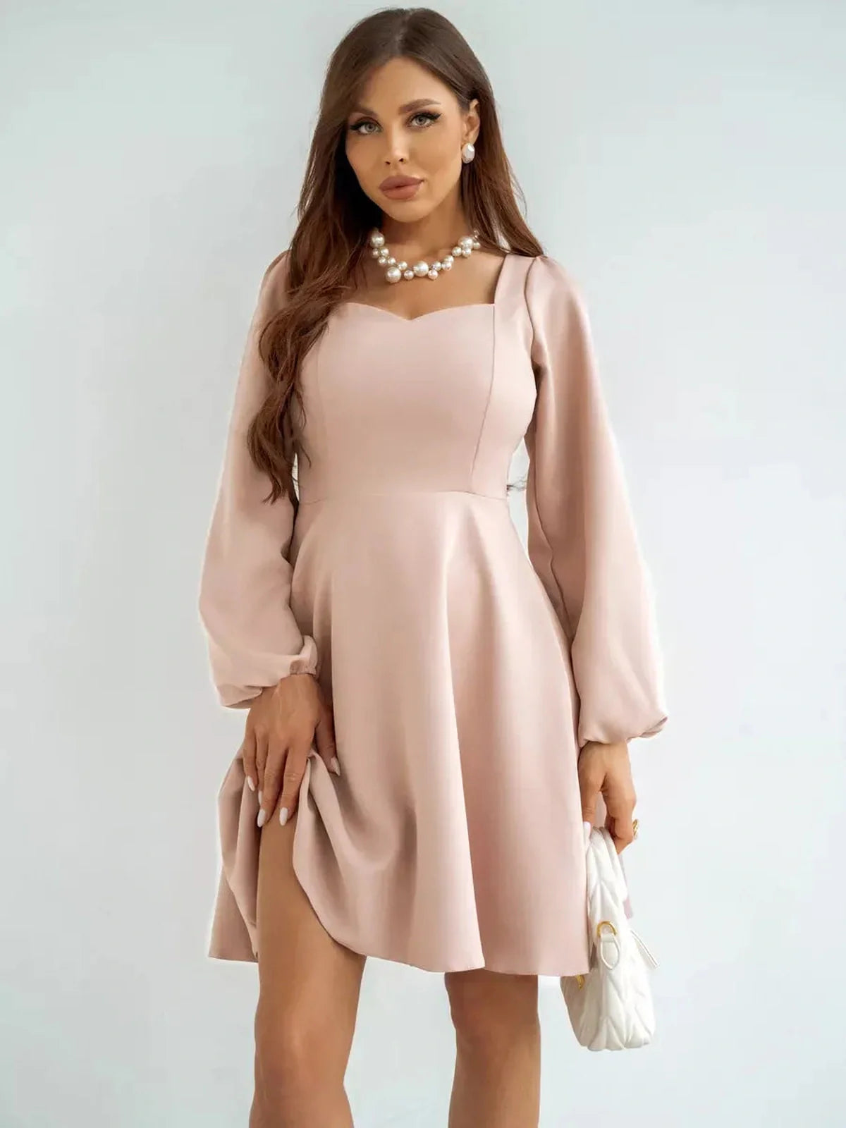 Milanese Mini Dress by Lauven in dusty blush, featuring long sleeves and a fitted A-line silhouette.