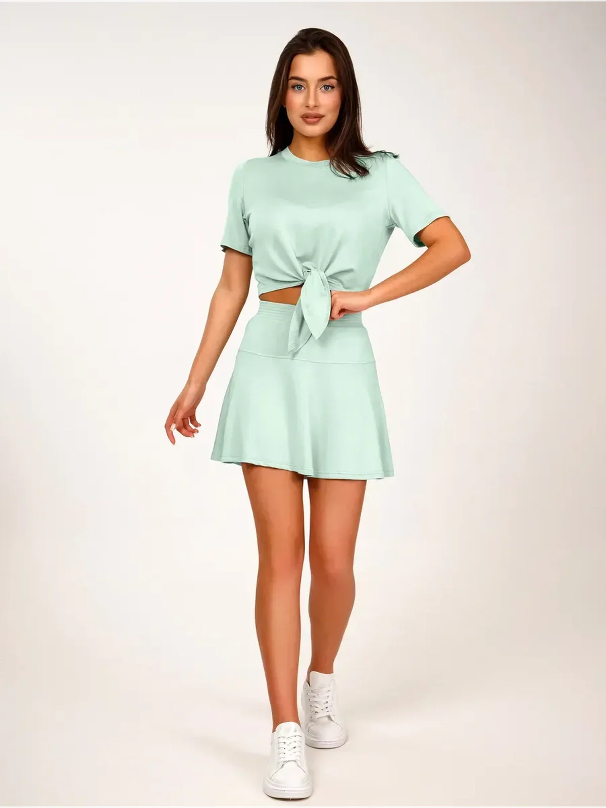 Mint Set - Mint green two-piece women’s suit by Lauven featuring tie-front top and flared mini skirt.