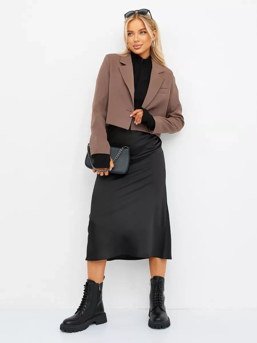Mocha Blazer by Lauven worn with a black skirt and boots, showcasing a chic, oversized cropped silhouette.